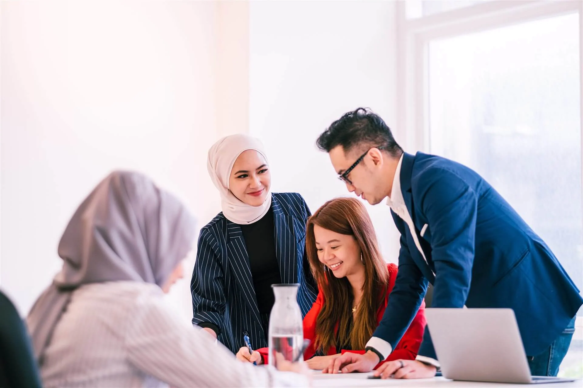 Diverse team collaborating in a meeting