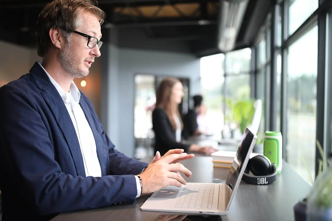 Professional working on a laptop in a modern office