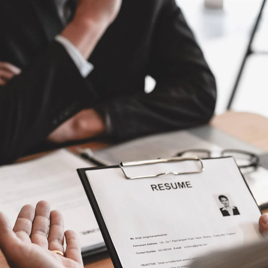 Recruiter reviewing a candidate’s résumé in an interview